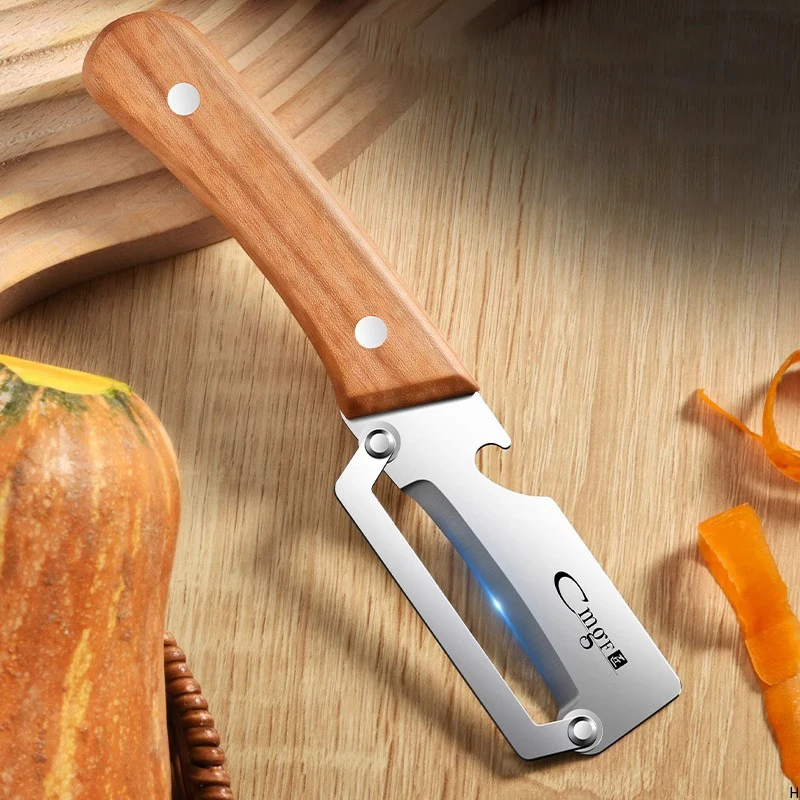 Stainless steel peeler with wooden handle for peeling and slicing fruits and vegetables